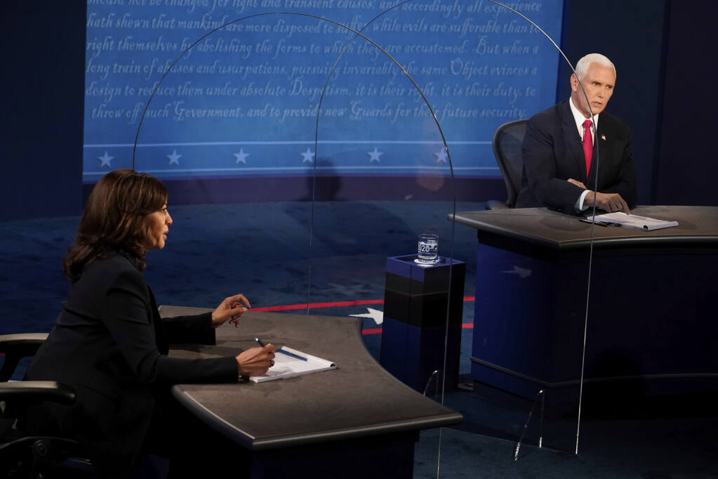 Democratic vice presidential candidate Sen. Kamala Harris, D-Calif., and Vice President Mike Pence answer questions during the vice presidential debate Wednesday, Oct. 7, 2020, at Kingsbury Hall on the campus of the University of Utah in Salt Lake City. (AP Photo/Morry Gash, Pool)