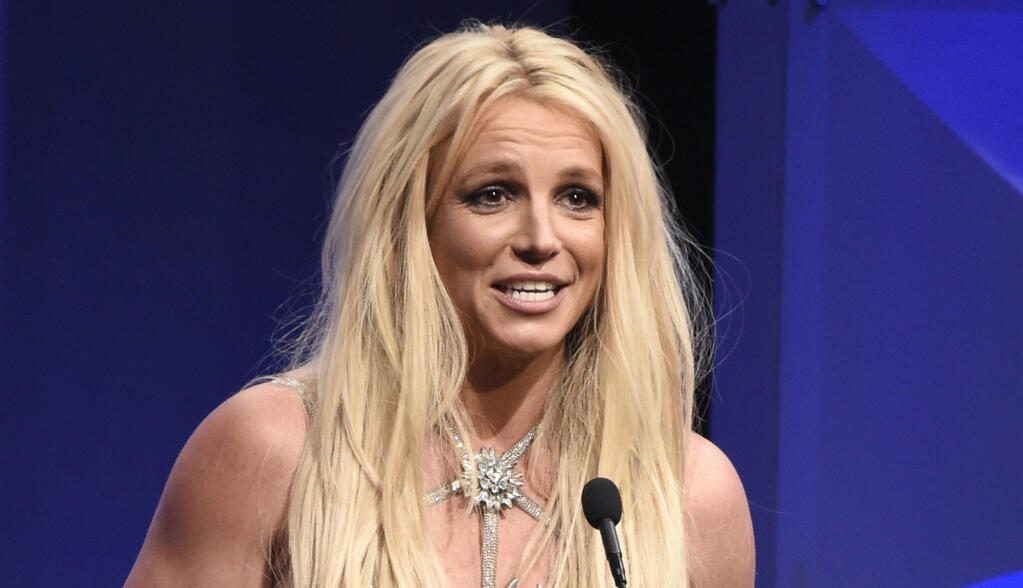 Britney Spears is the subject of a new documentary, "Framing Britney," which has sparked a reexamination of media treatment of the era's female celebrities. Many of them entered public life as minors yet were regularly interrogated about their developing bodies and sex lives. (Photo by Chris Pizzello/Invision/AP)