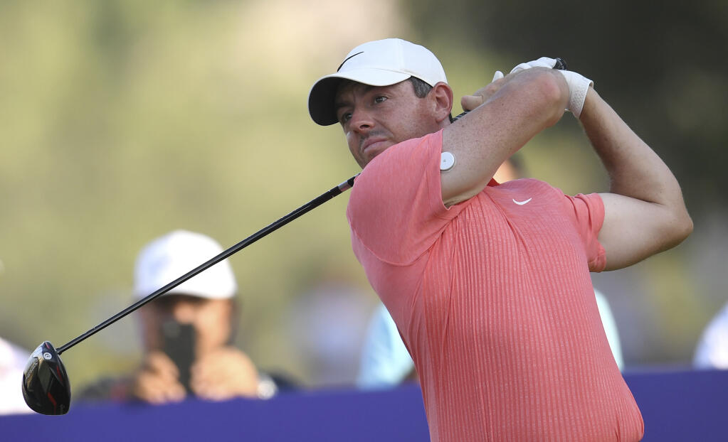 Rory McIlroy of Northern Ireland tees off at the 18th hole during the DP World Tour Championship No. 19 in Dubai, United Arab Emirates. (Martin Dokoupil / ASSOCIATED PRESS)