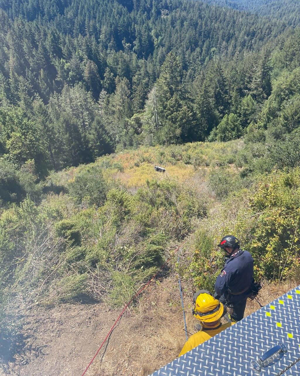 A Bay Area man was rescued Tuesday, Aug. 23, 2022 next to the overturned Land Rover that he drove over a cliff on the back roads of La Honda, the California Highway Patrol said. (Cal Fire CZU)