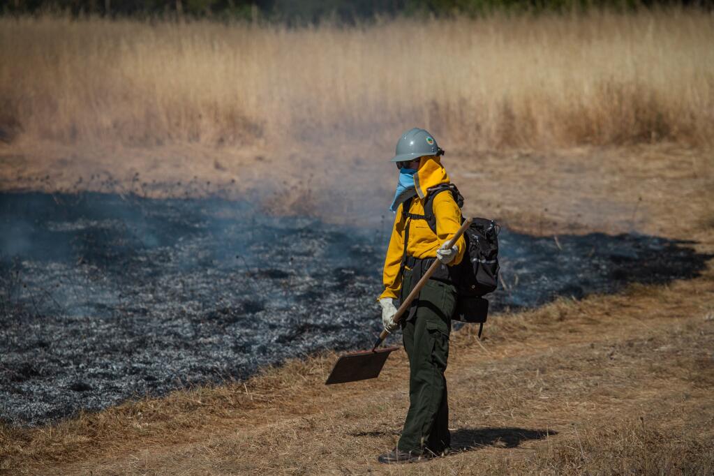 A Sonoma Valley firefighter at a prescribed burn at Van Hoosear Wildflower Preserve on Friday, June 3, 2021. (Lukas Wynne/Special to the Index-Tribune).