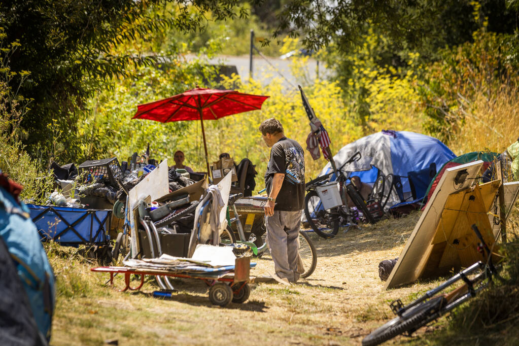A homeless encampment along Hinebaugh Creek in Rohnert Park on Friday, July 29, 2022. The city of Rohnert Park is considering an ordinance that would limit where unhoused people can camp. (John Burgess/The Press Democrat)