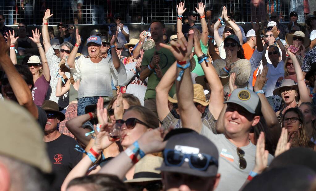 The crowd celebrates as the Avett Brothers perform during the Sonoma Harvest Music Festival at B.R. Cohn Winery in 2018. Whether or not such music events are ’agricultural’ in nature is one of the issues addressed in the draft winery event guidelines. (Photo by Darryl Bush / For The Press Democrat)
