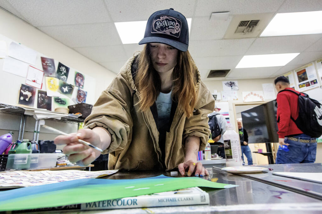 Kylie Lugger, 18, works on an art project at Creekside High School on Broadway on Monday, May 9, 2022. (Robbi Pengelly/Index-Tribune)