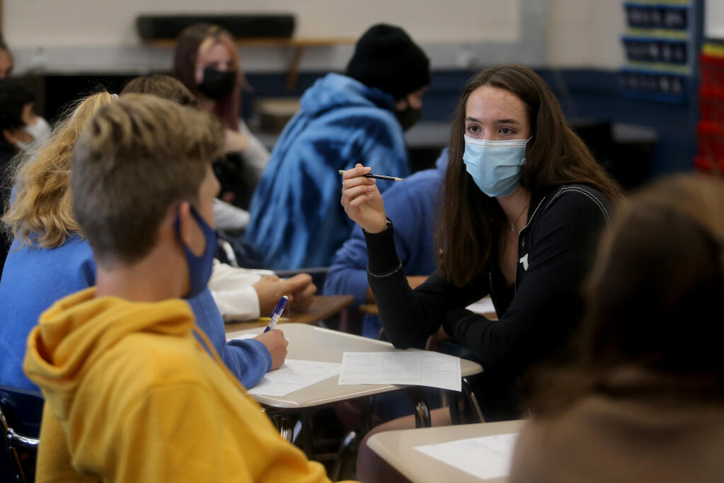 Rachel Cohen, 16, talks with classmates during triganometry class at West County High School, on the former Analy High School campus, in Sebastopol, Calif., on Thursday, Aug. 12, 2021.(Beth Schlanker/The Press Democrat)
