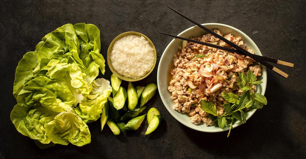 Larb Gai is served on lettuce cups with sticky rice by chef John Ash. (John Burgess / The Press Democrat)