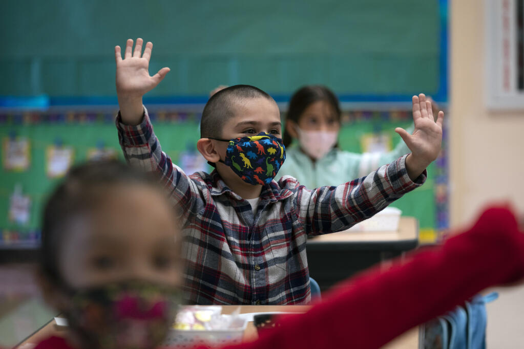 In this April 13, 2021, file photo, kindergarten students participate in a classroom activity on the first day of in-person learning at Maurice Sendak Elementary School in Los Angeles. (AP Photo/Jae C. Hong, File)