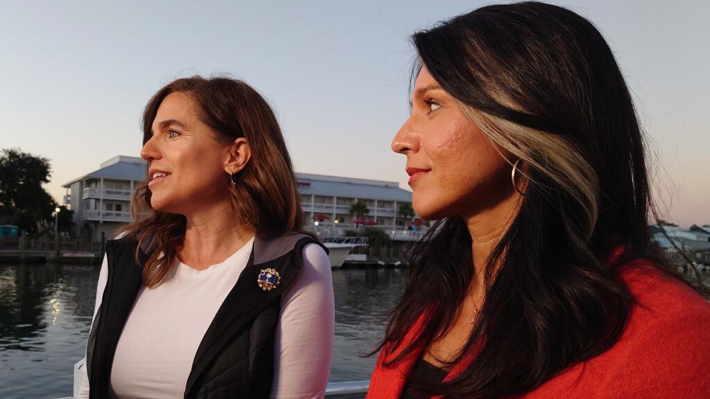 U.S. Rep. Nancy Mace, R-S.C., left, speaks with reporters at a campaign event with former U.S. Rep. Tulsi Gabbard of Hawaii, right, on Thursday, Nov. 3, 2022, in Mount Pleasant, S.C. Gabbard, who recently announced she was leaving the Democratic Party, has been hitting the campaign trail with a slew of Republican candidates across the country ahead of the midterm elections. (AP Photo/Meg Kinnard)