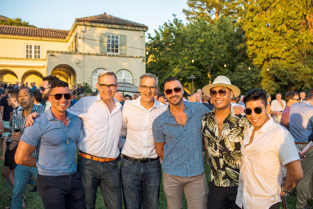 A group celebrating at the Twilight T-Dance, the signature event of the Gay Wine Weekend. It was held at Kenwood’s Chateau St. Jean. (Gary Saperstein)