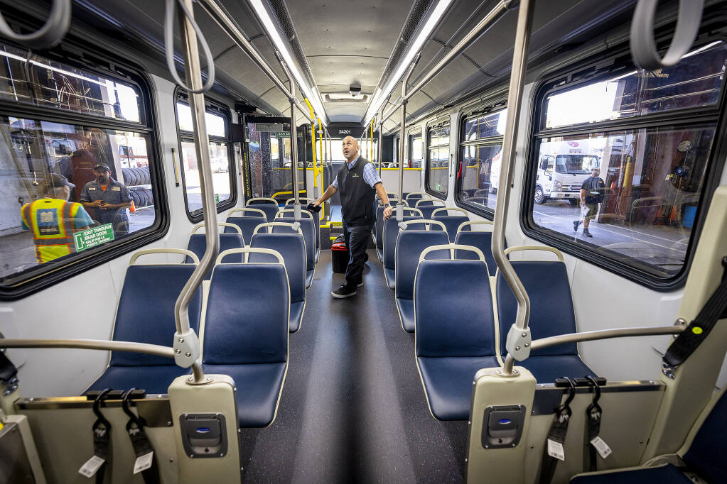 Proterra sales director Mark Hollenbeck inspects the interior of one of the two all-electric buses purchased by the city of Santa Rosa Sept. 28, 2022. Santa Rosa took delivery of two all-electric buses this week and have two more on order. (John Burgess/The Press Democrat)