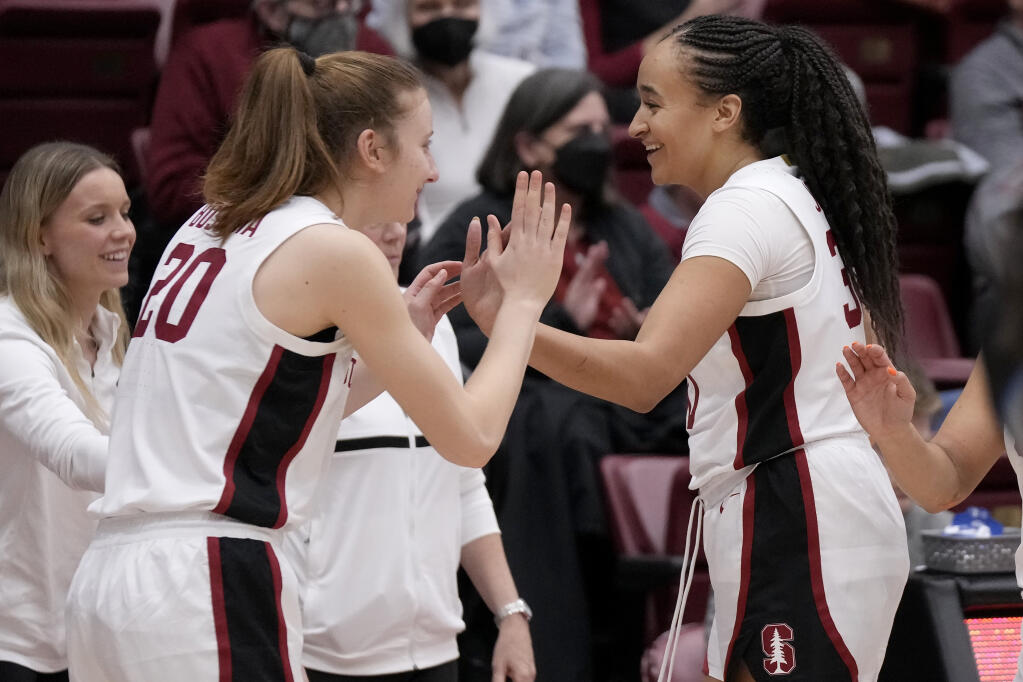 Stanford guard Elena Bosgana, left, celebrates with guard Haley Jones after defeating Creighton Tuesday in Stanford. (Jeff Chiu / ASSOCIATED PRESS)