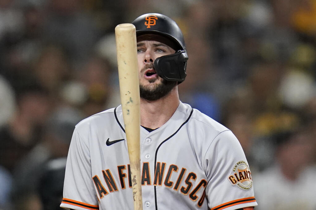 San Francisco Giants' Kris Bryant adjusts his bat while batting during the sixth inning of a baseball game against the San Diego Padres, Wednesday, Sept. 22, 2021, in San Diego. (AP Photo/Gregory Bull)