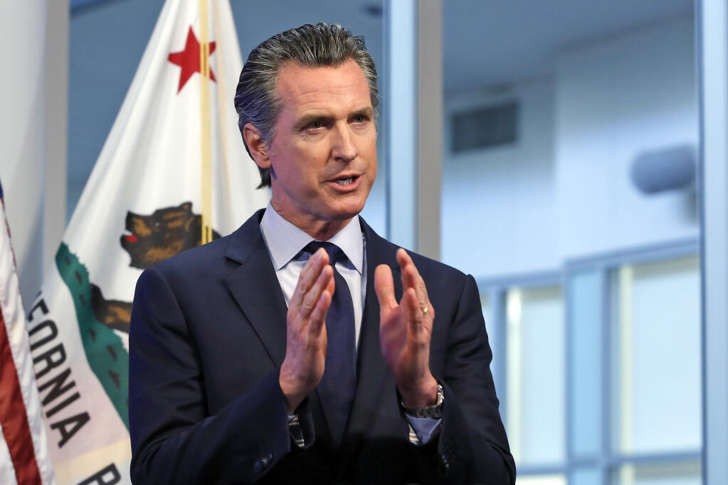 FILE - In this April 14, 2020, file photo, California Gov. Gavin Newsom discusses an outline for what it will take to lift coronavirus restrictions during a news conference at the Governor's Office of Emergency Services in Rancho Cordova, While California will end most coronavirus rules on June 15, Gov. Gavin Newsom said Friday, June 4, 2021 he will not lift the â€œstate of emergencyâ€ that has been in place since March 2020. (AP Photo/Rich Pedroncelli, Pool, File)