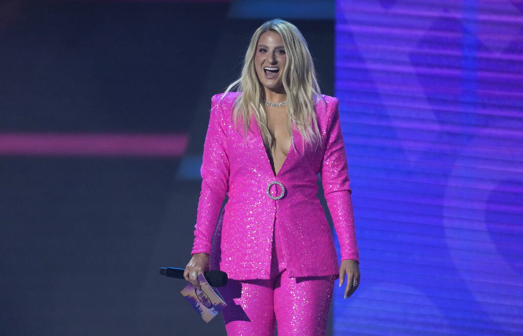 Meghan Trainor presents the award for favorite rock artist at the American Music Awards on Sunday, Nov. 20, 2022, at the Microsoft Theater in Los Angeles. (AP Photo/Chris Pizzello)