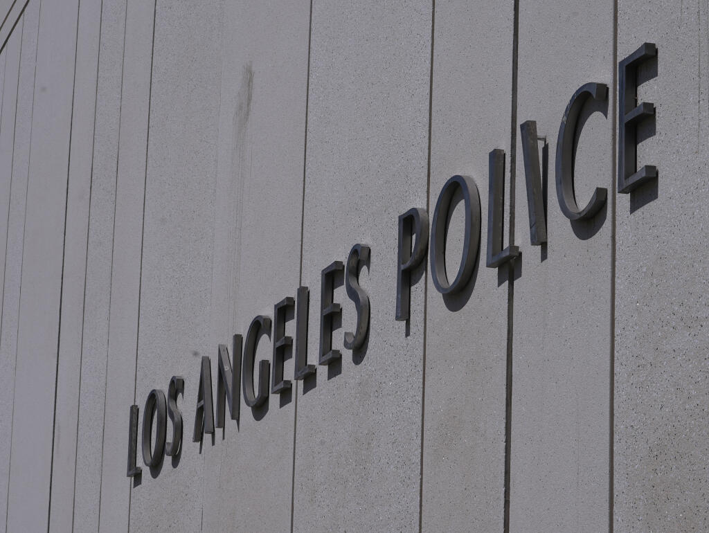 The Los Angeles Police Department headquarters building is seen in downtown Los Angeles on Friday, July 8, 2022. Los Angeles police officers shot and killed a man who was allegedly armed with a knife Thursday evening, marking the third fatal police shooting in a week for the department. (AP Photo/Damian Dovarganes)