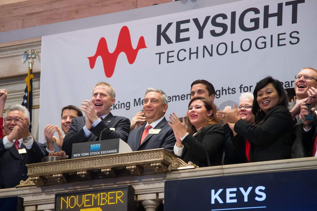 Keysight Technologies executives, led by President and CEO Ron Nersesian, visit the New York Stock Exchange on Nov. 3, 2014, to ring the opening bell. (Photo by Ben Hider/NYSE)