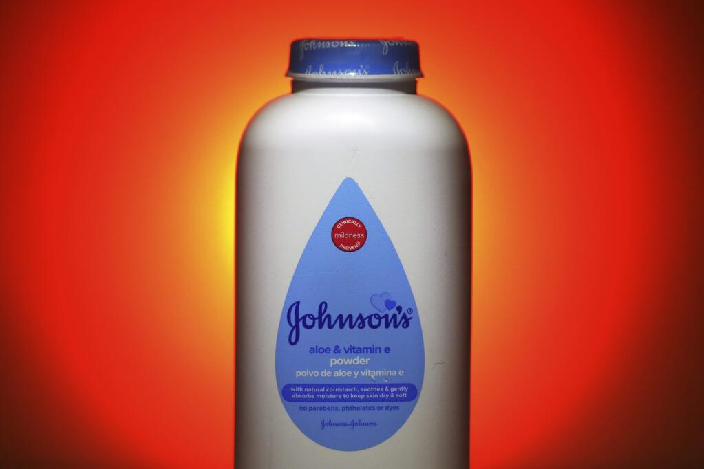 FILE - This Oct. 21, 2019, photo shows Johnson's Baby Aloe & Vitamin E Powder in Salt Lake City. Johnson & Johnson reports financial results Tuesday, April 14, 2020. Johnson & Johnson is ending production of its iconic talc-based Johnson's Baby Powder, which has been embroiled in thousands of lawsuits claiming it caused cancer. The world's biggest maker of health care products said Tuesday, May 19, 2020 that the discontinuation only affects the U.S. and Canada, where demand has been declining. (AP Photo/Rick Bowmer, File)