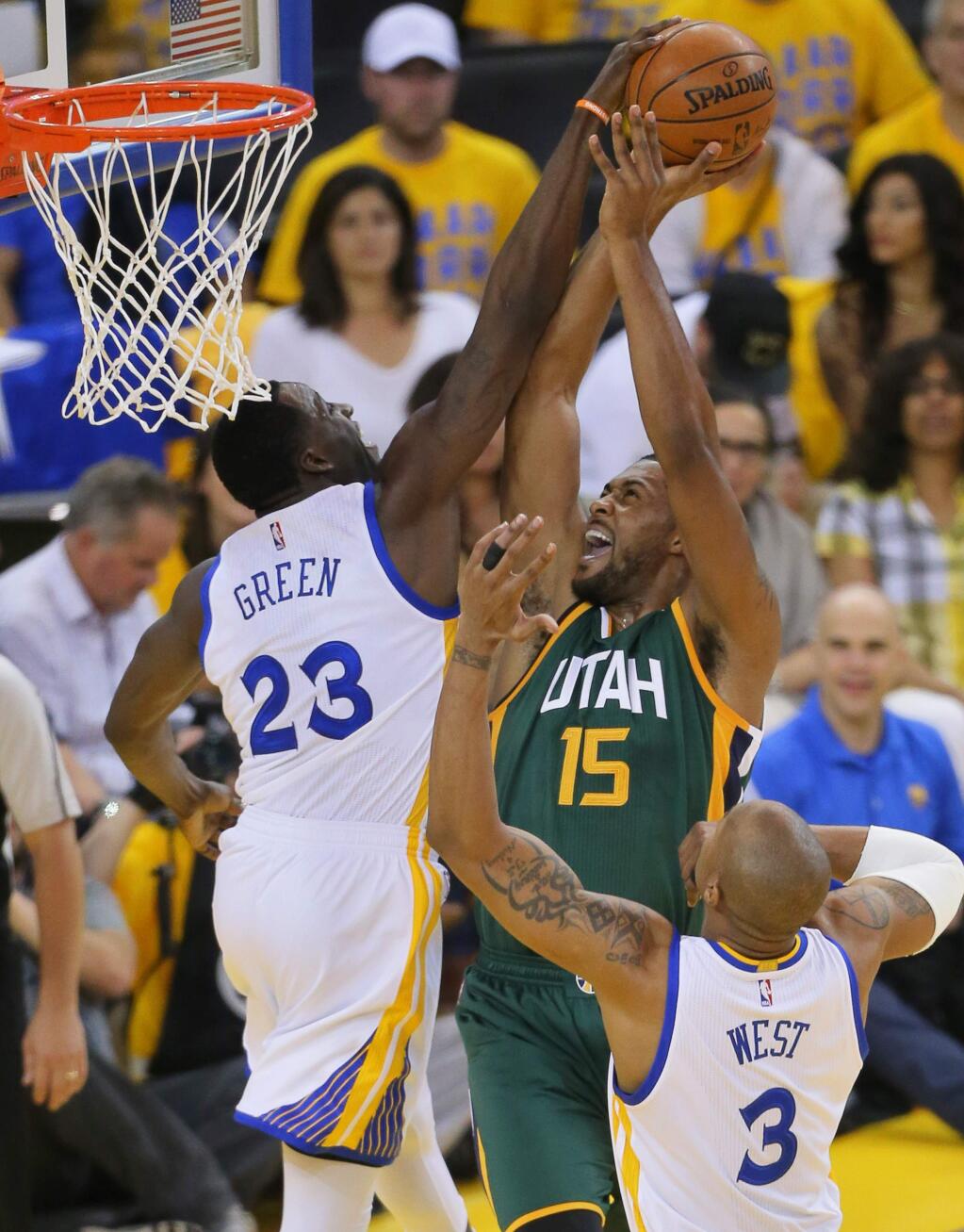 Golden State Warriors forward Draymond Green blocks a shot attempt by Utah Jazz center Derrick Favors, during Game 1 of the of NBA Western Conference Semifinals in Oakland on Tuesday, May 2, 2017. (Christopher Chung/ The Press Democrat)