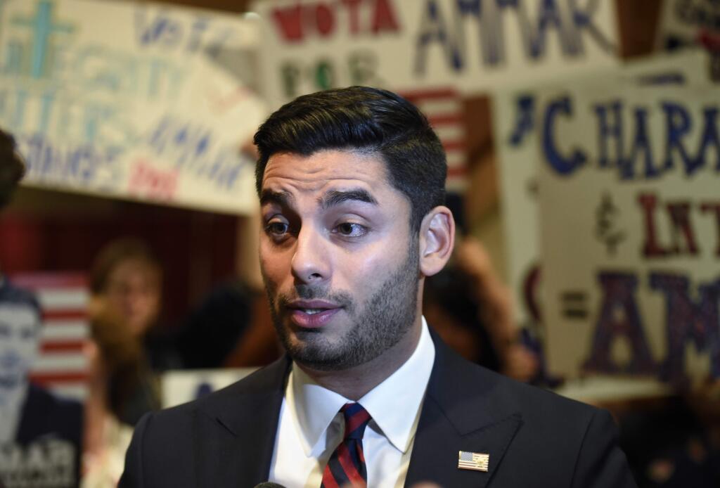Democratic congressional candidate Ammar Campa-Najjar talks to supporters on Tuesday Nov. 6, 2018, in San Diego. Campa-Najjar faces Republican U.S. Rep. Duncan Hunter in the race for Southern California's 50th district. Hunter leads his opponent in early returns despite facing federal corruption charges. (AP Photo/Denis Poroy)