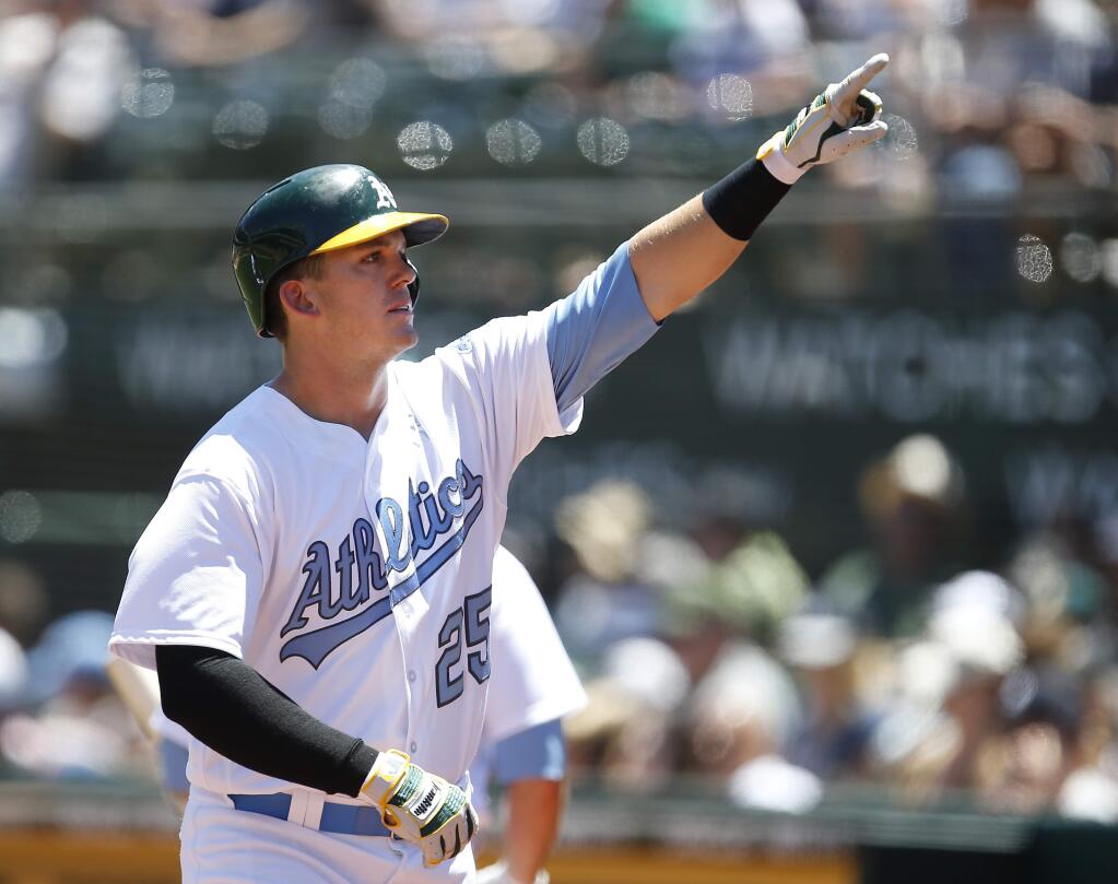 Oakland Athletics' Ryon Healy (25) points to the crowd after hitting a solo home run against the New York Yankees during the second inning Saturday, June 17, 2017 in Oakland. (AP Photo/Tony Avelar)