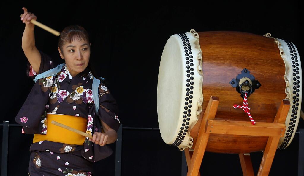 Hitomi Kimura performed the Hachijo Daiko Opening with her husband Hideaki Nishikura during the Matsuri Japanese Arts Festival held at Juilliard Park, Saturday, May 2, 2015. (CRISTA JEREMIASON / The Press Democrat)