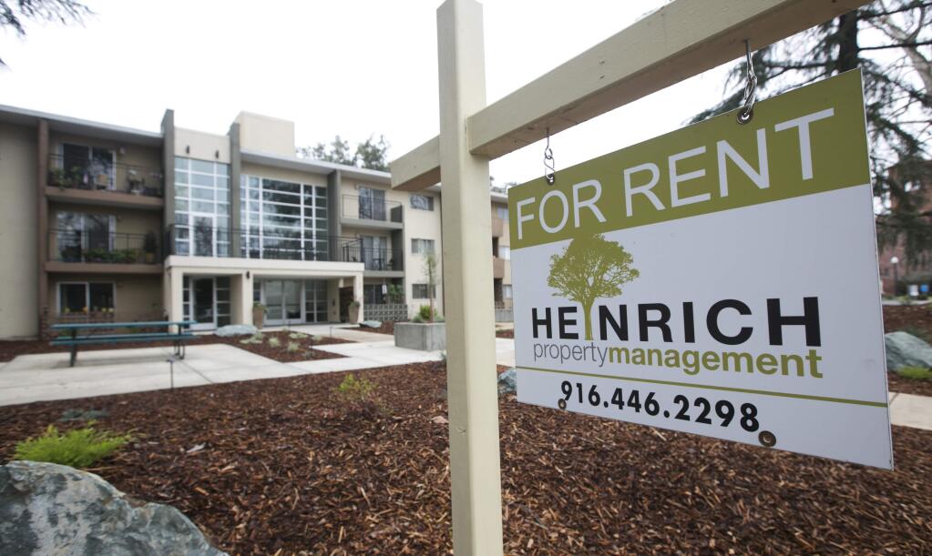 FILE - In this Jan. 8, 2018, file photo 'For Rent' sign is posted outside an apartment building in Sacramento, Calif. Californians who rent apartments built after 1995, single-family homes or condominiums have limited protections from rising costs under a state law passed that year that restricts rent control. That could change if voters pass Proposition 10 in November. It would overturn the 1995 law and open the door to more rent control in cities and counties across the state. (AP Photo/Rich Pedroncelli, File)
