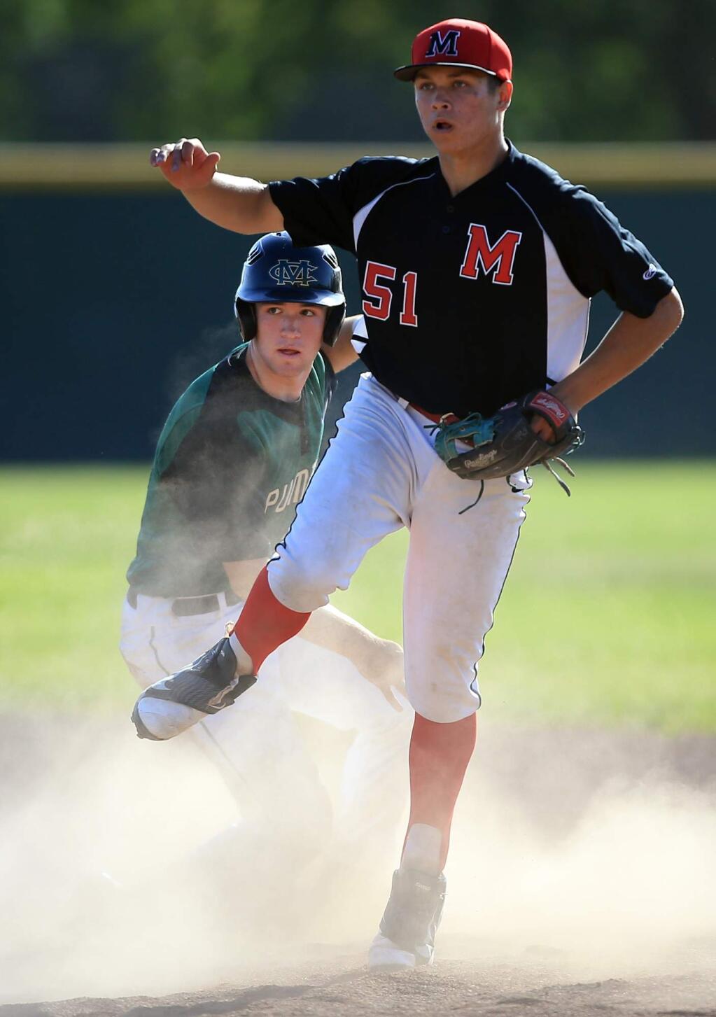 Montgomery's Cody Lyons attempts to complete a double play past the sliding Nick Quarles of Maria Carrillo, Wednesday May 18, 2016 at Maria Carrillo High School in Santa Rosa. (Kent Porter / Press Democrat) 2016