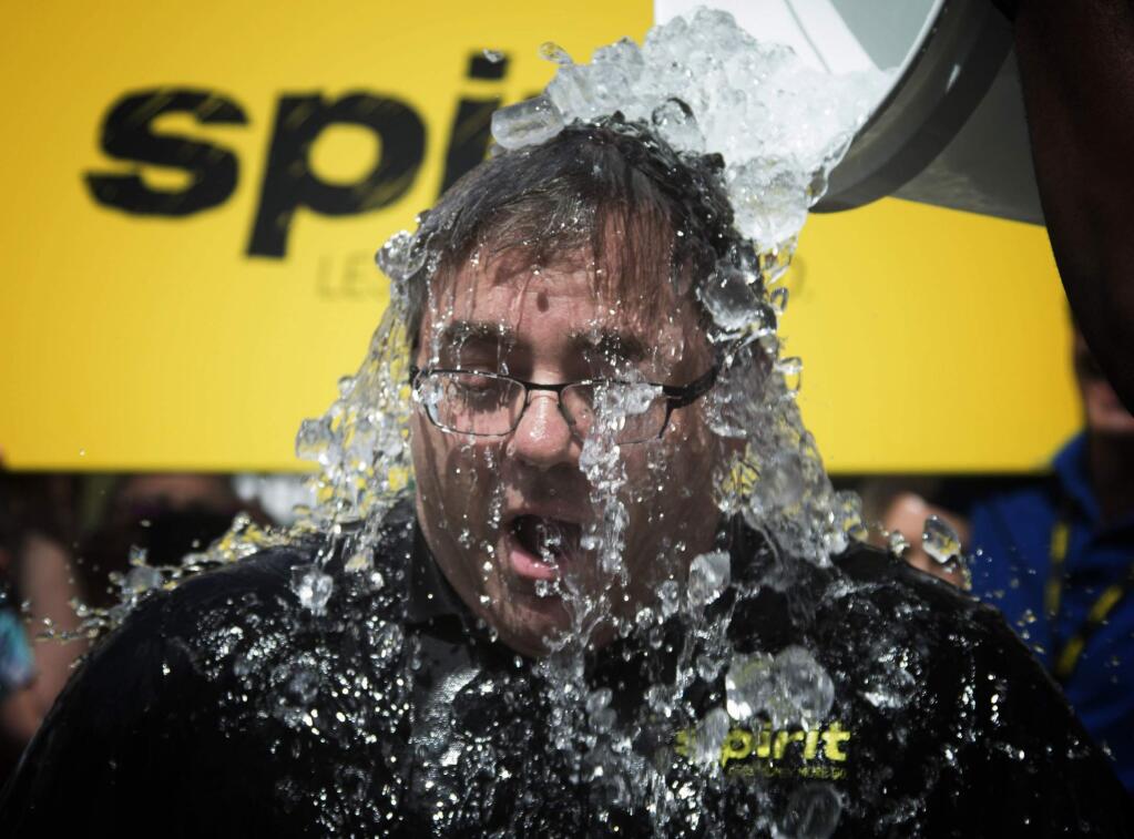 This Aug. 18, 2014 file photo shows Spirit Airlines President and CEO, Ben Baldanza taking the Ice Bucket Challenge at the company's Miramar, Fla. headquarters. (AP Photo/J Pat Carter, File)