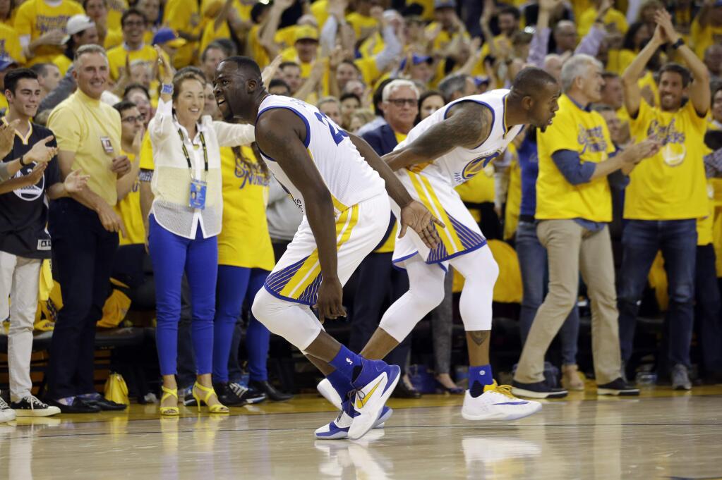 Golden State Warriors' Draymond Green, left, celebrates with teammate Andre Iguodala after a score during the second half in Game 2 of a second-round NBA basketball playoff series against the Portland Trail Blazers Tuesday, May 3, 2016, in Oakland, Calif. Golden State won 110-99. (AP Photo/Marcio Jose Sanchez)