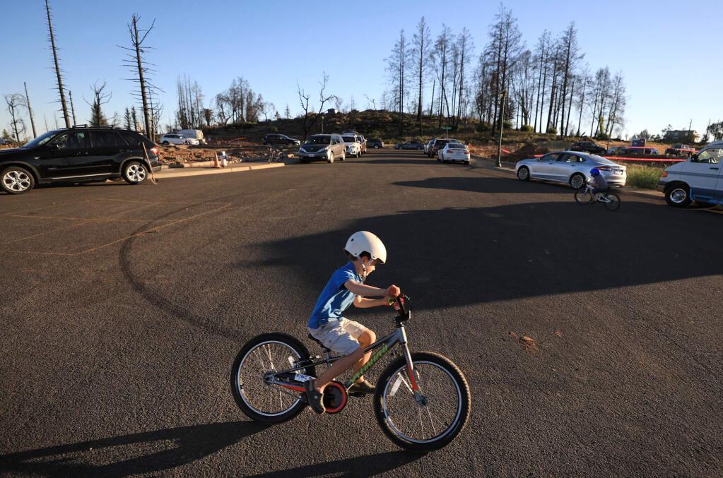 Rowan Dunlop, 5, enjoys his bike ride, Monday, July 16, 2018 in Santa Rosa's Rincon Ridge neighborhood of Fountaingrove during a neighborhood get together. (Kent Porter / The Press Democrat) 2018