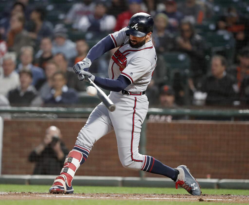 Atlanta Braves' Nick Markakis (22) hits a single against the San Francisco Giants during the second inning of a baseball game in San Francisco, Tuesday, Sept. 11, 2018. (AP Photo/Tony Avelar)