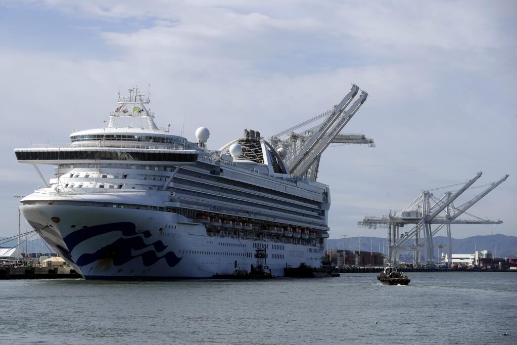 The Grand Princess cruise ship is shown docked at the Port of Oakland in Oakland, Calif., Tuesday, March 10, 2020. After days of being forced to idle off the Northern California coast, the ship docked Monday at Oakland with about 3,500 passengers and crew, including some who tested positive for the new virus.(AP Photo/Jeff Chiu)
