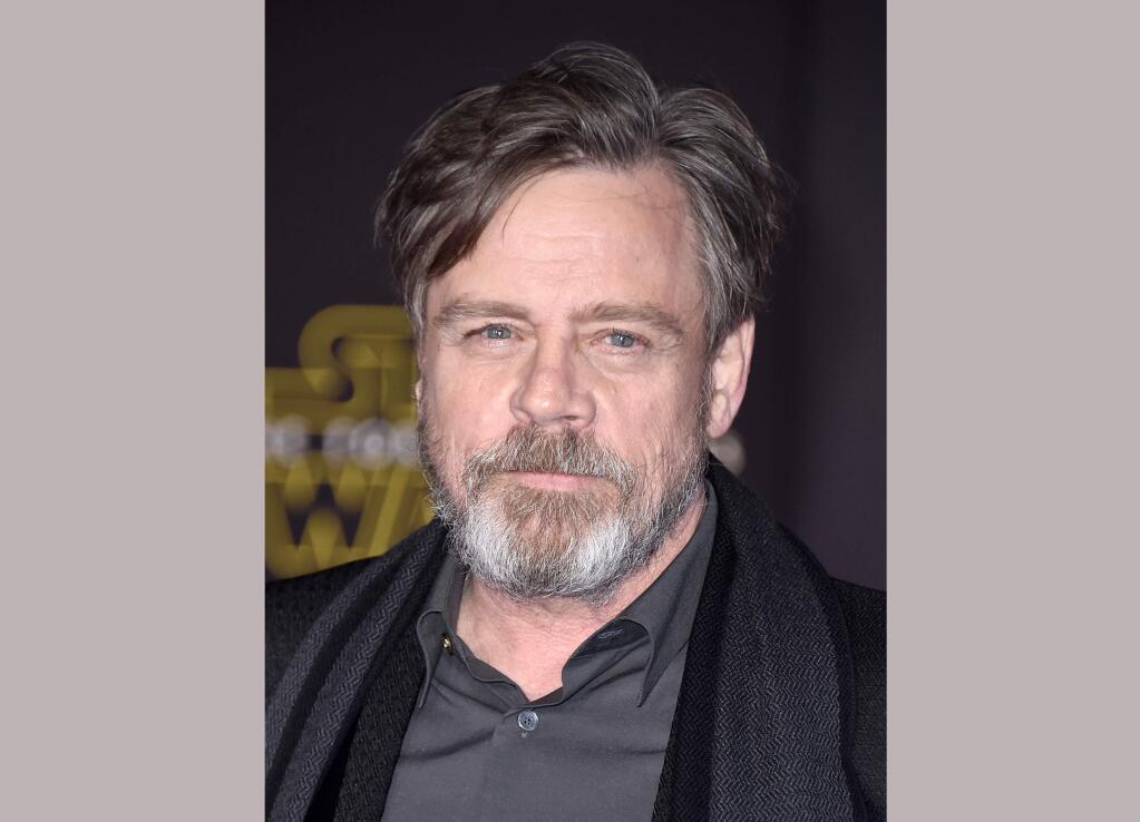 FILE - In this Dec. 14, 2015 file photo, Mark Hamill arrives at the world premiere of 'Star Wars: The Force Awakens' in Los Angeles. Hamill is lending his support to a terminally ill fan who wants to see 'Rogue One: A Star Wars Story' before he dies. Illustrator Neil Hanvey from Oldham, England, was informed by doctors in April that he has six to eight months to live. 'Rogue One' is set for release Dec. 16. (Photo by Jordan Strauss/Invision/AP, File)