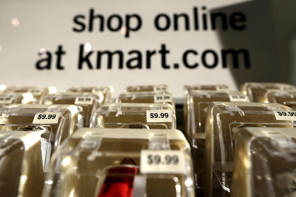 FILE - In this Thursday, Nov. 28, 2013, file photo, watches are on display at Kmart in New York. The Friday after Thanksgiving has long been the day to grab the best bargains of the holiday shopping season. But new data from various companies that track the specials now say Thanksgiving is taking that crown, at least online. (AP Photo/Julio Cortez, File)