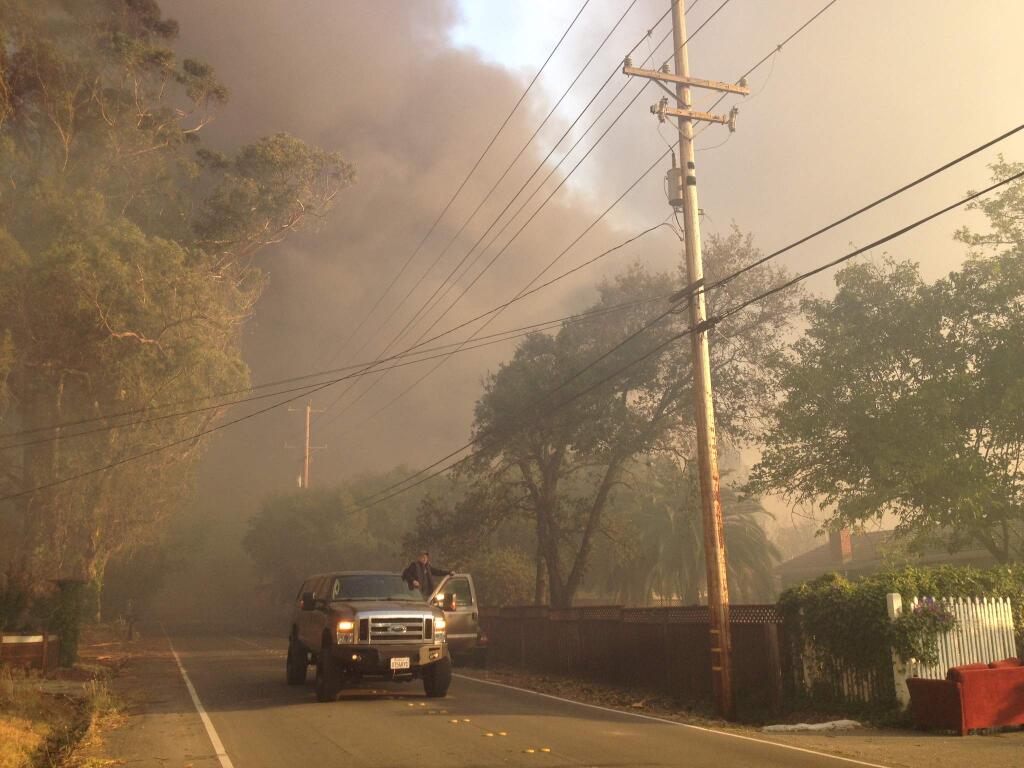 The fire moves down Baird Road in Santa Rosa, Monday, Oct. 9, 2017. (Chris Smith / Press Democrat)