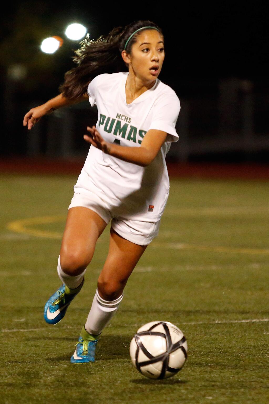 Maria Carrillo's Maddy Gonzalez (4) looks to make a crossing pass during the first half of the NCS Division 1 championship girls soccer match between Maria Carrillo and Montgomery high schools in Santa Rosa, California on Saturday, November 14, 2015. (Alvin Jornada / The Press Democrat)