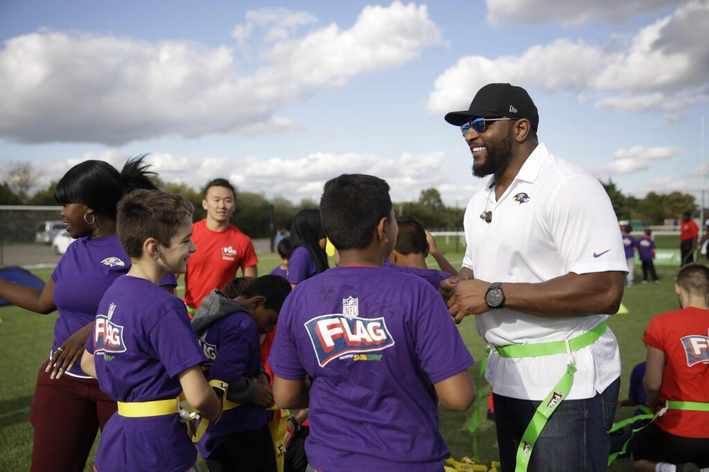 Baltimore Ravens former player Ray Lewis takes part in a NFL Flag event with schoolchildren at London Irish training ground in London, England, Friday, Sept. 22, 2017. (AP Photo/Matt Dunham)