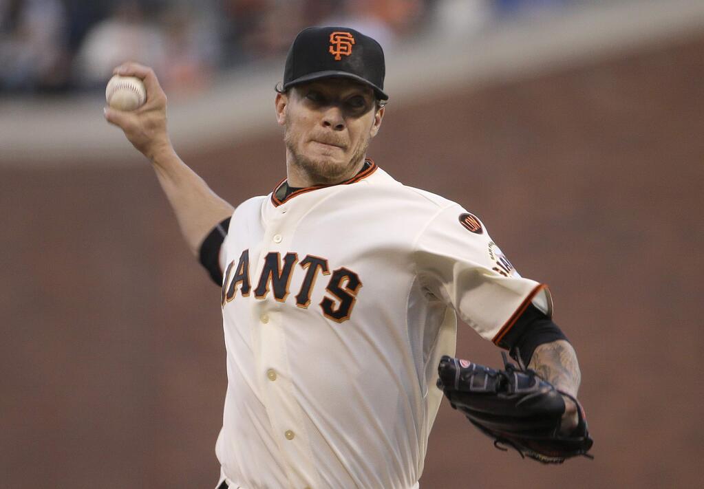 San Francisco Giants pitcher Jake Peavy throws against the Chicago Cubs during the first inning of a baseball game in San Francisco, Wednesday, Aug. 26, 2015. (AP Photo/Jeff Chiu)