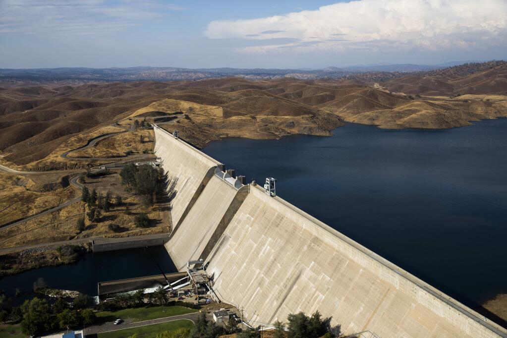 Friant Dam feeds the Friant-Kern Canal, one of the potential beneficiaries of Proposition 3 on the Nov. 6 ballot. The federally owned canal is sinking due to overpumping of groundwater in the Central Valley. (MAX WHITTAKER / New York Times)