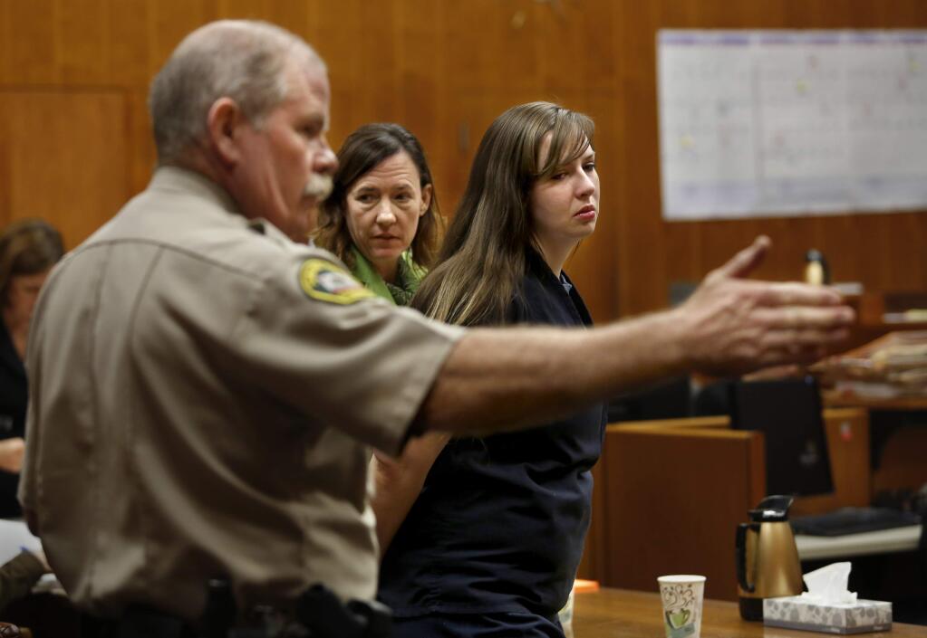 Heather Howell, with her attorney Chief Deputy Public Defender Kristine Burk, is directed by the bailiff during a sentencing hearing at the Sonoma County Superior Court in Santa Rosa, California on Monday, December 8, 2014. (BETH SCHLANKER/ The Press Democrat)