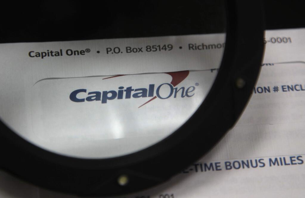 This July 22, 2019, photo shows Capital One mail in North Andover, Mass. A security breach at Capital One Financial, one of the nation's largest issuers of credit cards, compromised the personal information of about 106 million people, and in some cases the hacker obtained Social Security and bank account numbers. It is among the largest security breaches of a major U.S. financial institution on record. The bank's stock dipped 6% at the opening of trading Tuesday, July 30. (AP Photo/Elise Amendola)