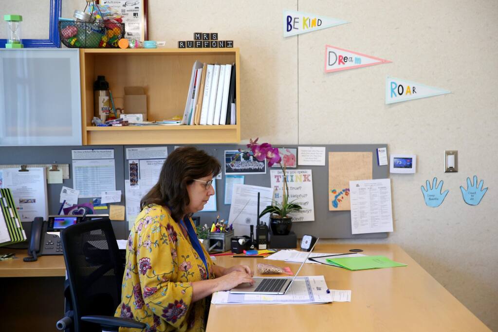 Principal Teresa Ruffoni works in her office at Richard Crane Elementary School in Rohnert Park in Rohnert Park, Calif., on Wednesday, June 10, 2020. (BETH SCHLANKER/ The Press Democrat)