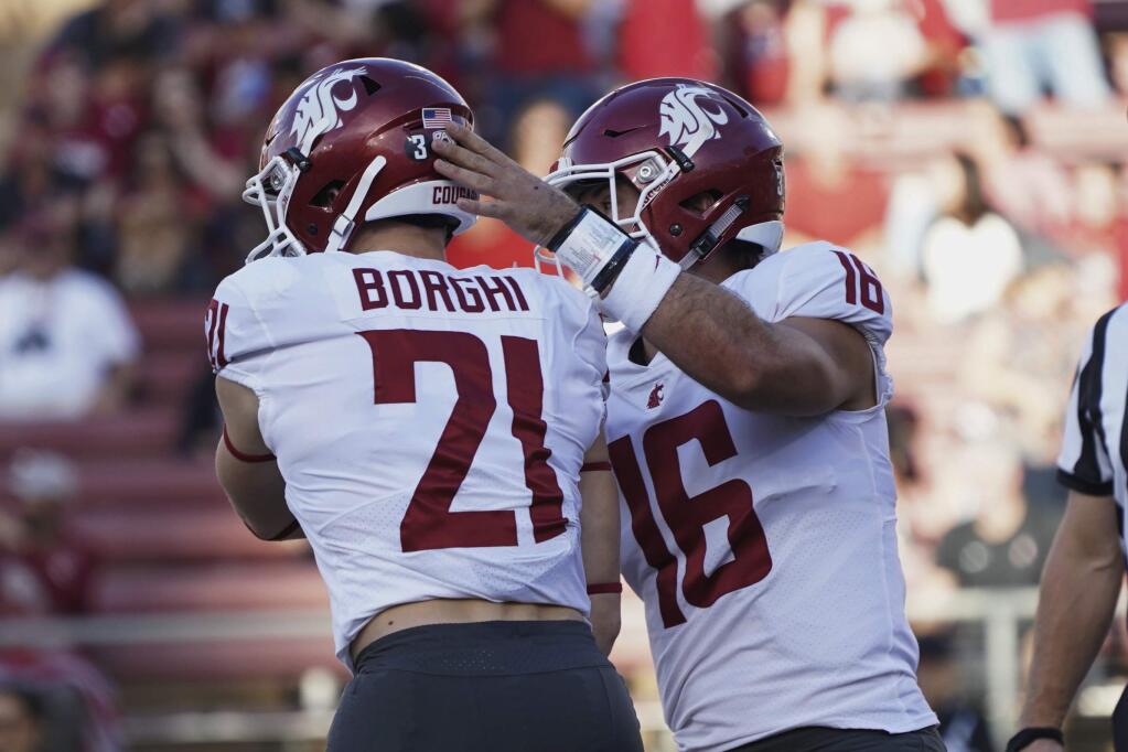 Washington State running back Max Borghi celebrates with quarterback Gardner Minshew II after scoring a touchdown in the first half against Stanford on Saturday, Oct. 27, 2018, in Stanford. (AP Photo/Don Feria)