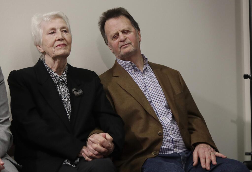 Edwin Hardeman, right, sits with his wife Mary at a news conference in San Francisco, Wednesday, March 27, 2019. (AP Photo/Jeff Chiu)