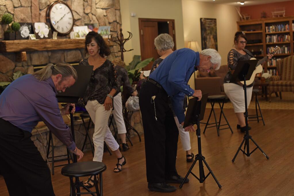 Members of the Kelly Street Cabaret setting up before a Saturday afternoon performance at Brookdale Paulin Creek, an independent and assisted living center for seniors, in Santa Rosa, California. August 10, 2019.(Photo: Erik Castro/for The Press Democrat)