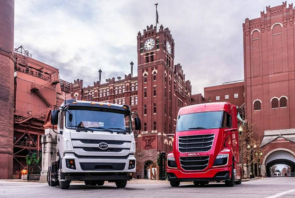 Anheuser-Busch in November 2019 demonstrated Nikola Motors' fuel-cell truck, left, and BYD Motors' electric truck at its Budweiser brewery in St. Louis. The beverage company has ordered hundreds of the vehicles. (courtesy of Anheuser-Busch)