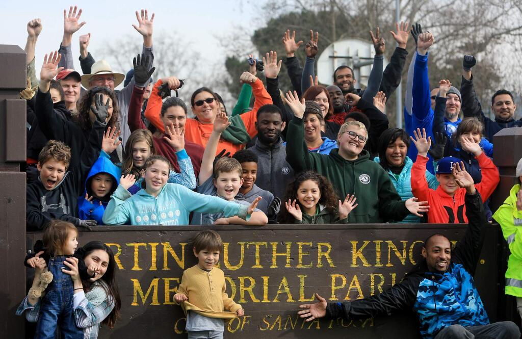 Volunteers are photographed by a city of Santa Rosa employee after helping to spruce up the Martin Luther King Memorial Park in Santa Rosa, in celebration of MLK, Monday Jan. 15, 2018. (Kent Porter / Press Democrat) 2018