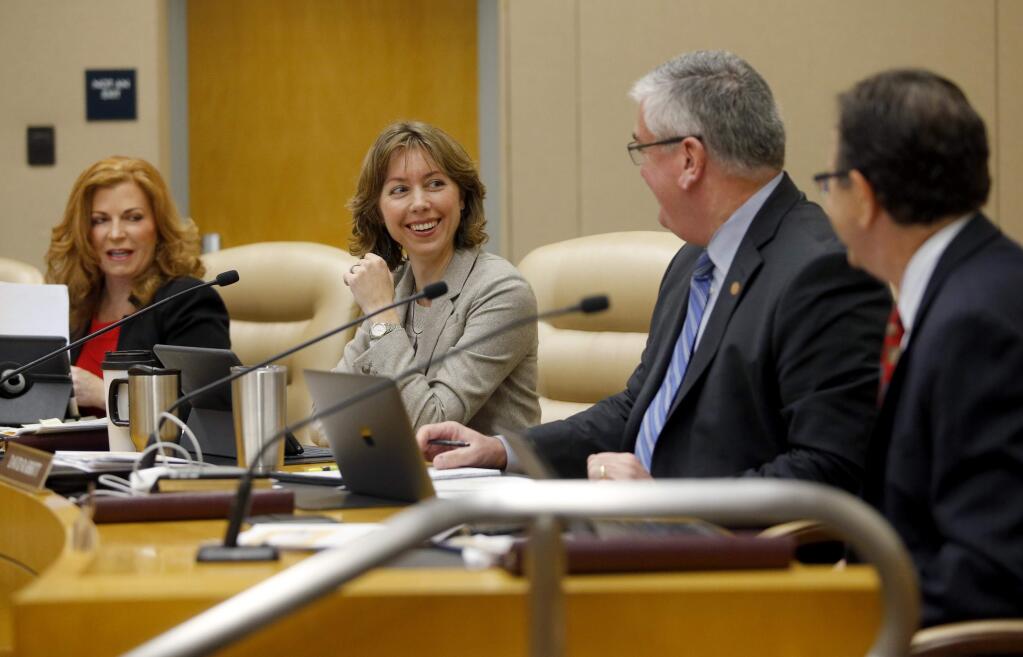 Sonoma County's 5th District supervisor Lynda Hopkins laughs with 2nd District supervisor David Rabbitt during the Sonoma County Board of Supervisors meeting in Santa Rosa, on Tuesday, January 10, 2017. (BETH SCHLANKER/ The Press Democrat)