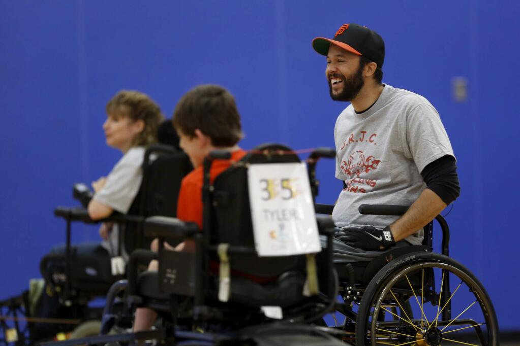 Anthony Hargrove, a member of the SRJC Rolling Bears wheelchair soccer team, plays during their game against the Sacramento Flames team at Analy High School in Sebastopol, on Sunday, July 13, 2014. (BETH SCHLANKER/ The Press Democrat)
