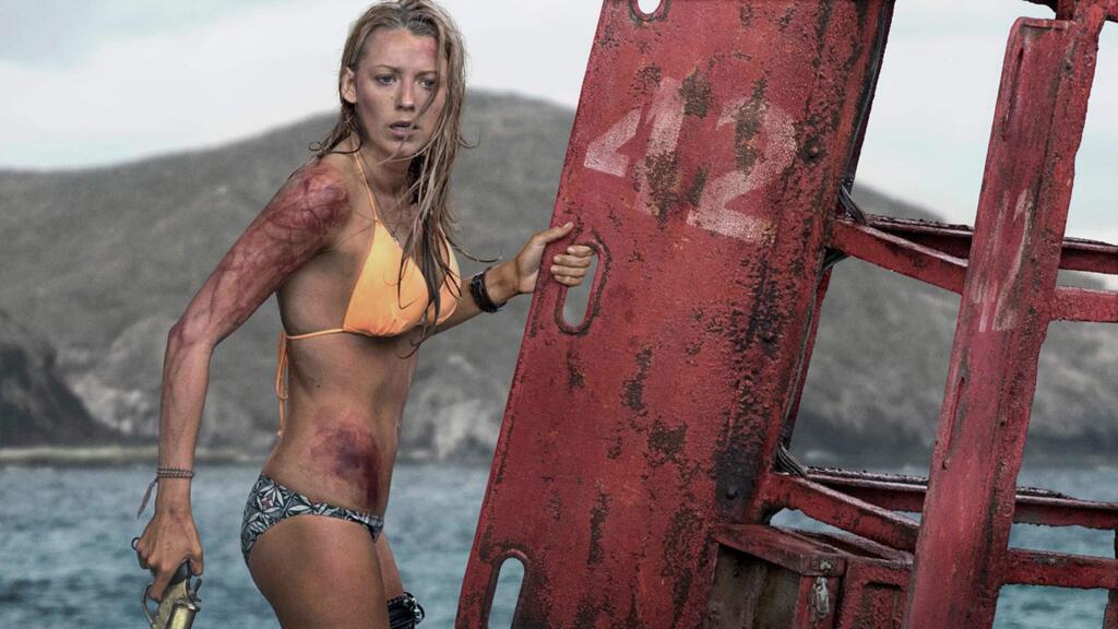 Blake Lively stars a a surfer stranded 200 yards off shore by a massive great white shark preventing her from getting back to land in 'The Shallows.' (COLUMBIA PICTURES)